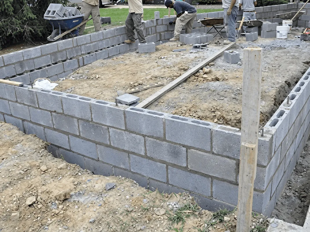 Professionals building a foundation with blocks in Knoxville, TN