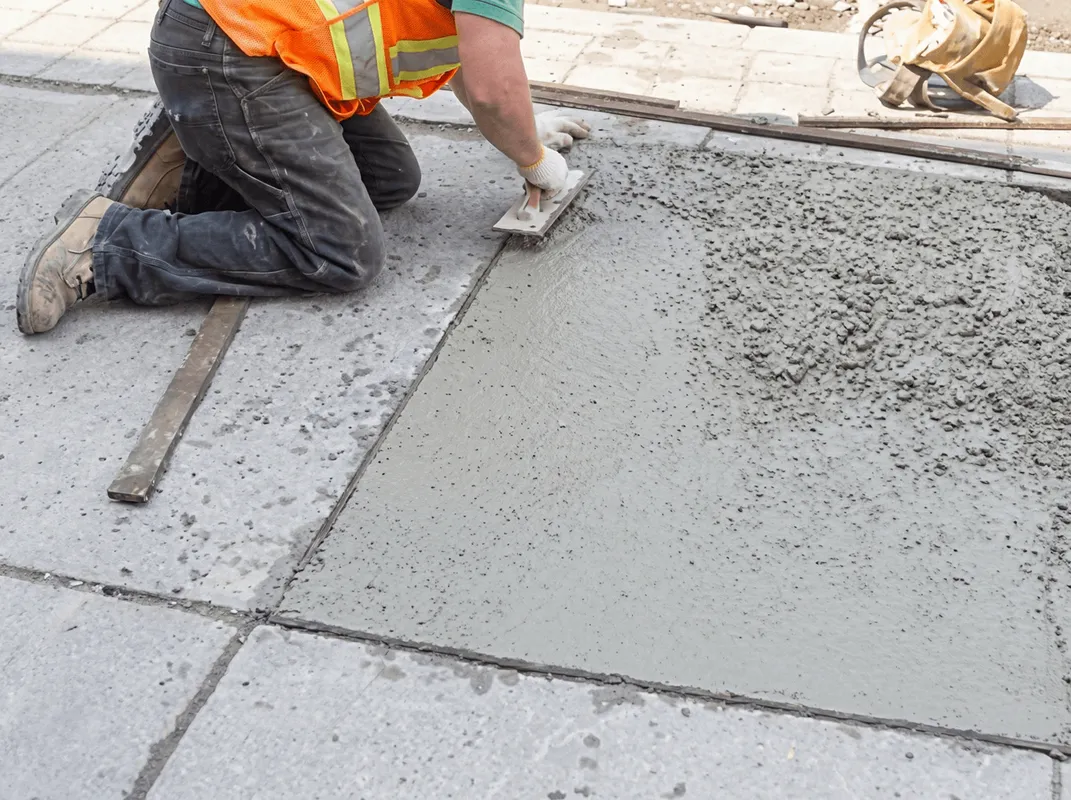 Professional repairing a concrete floor in Knoxville, TN